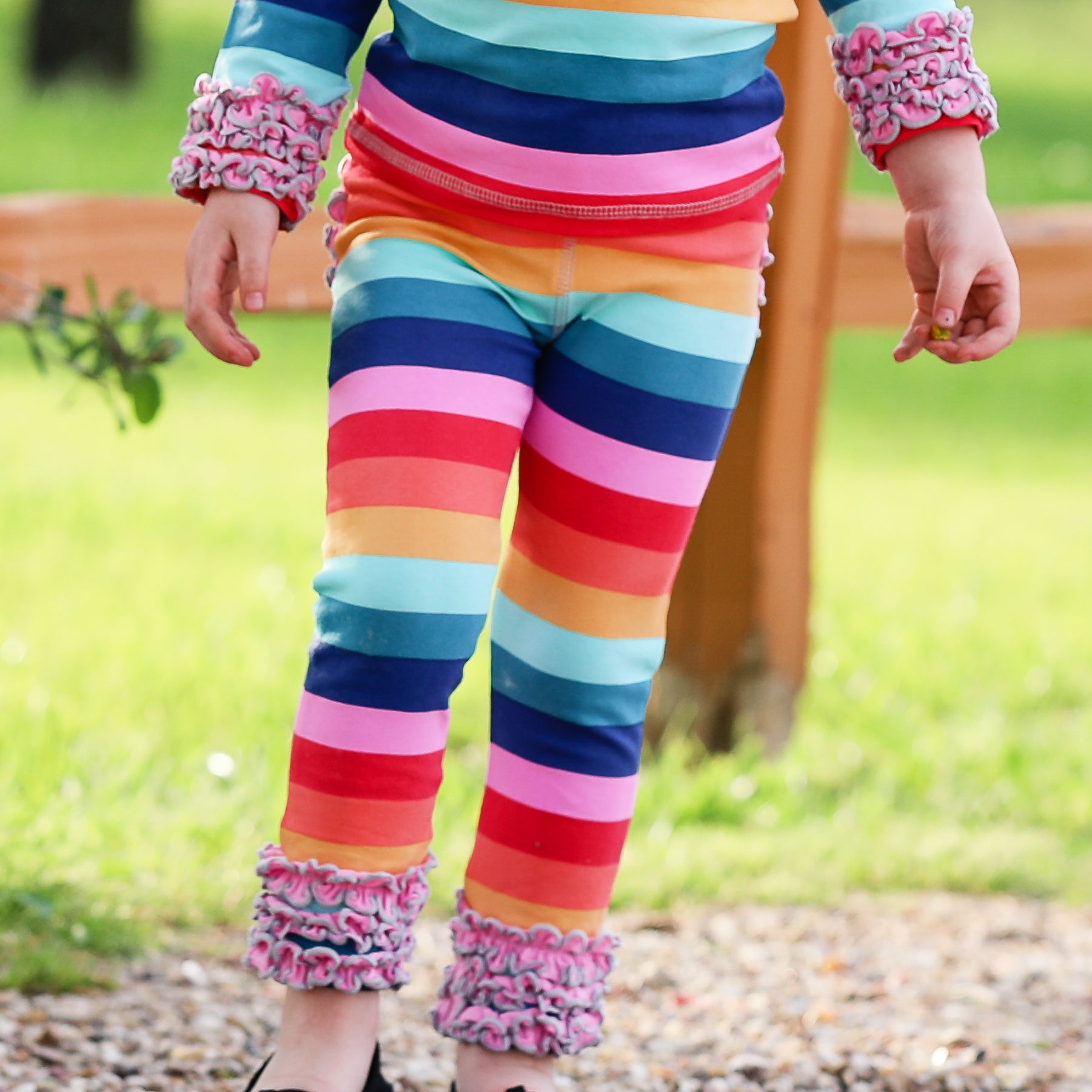 AnnLoren Rainbow Ruffle Butt Leggings for girls, featuring ruffles on the butt and ankles, made from soft Egyptian cotton.